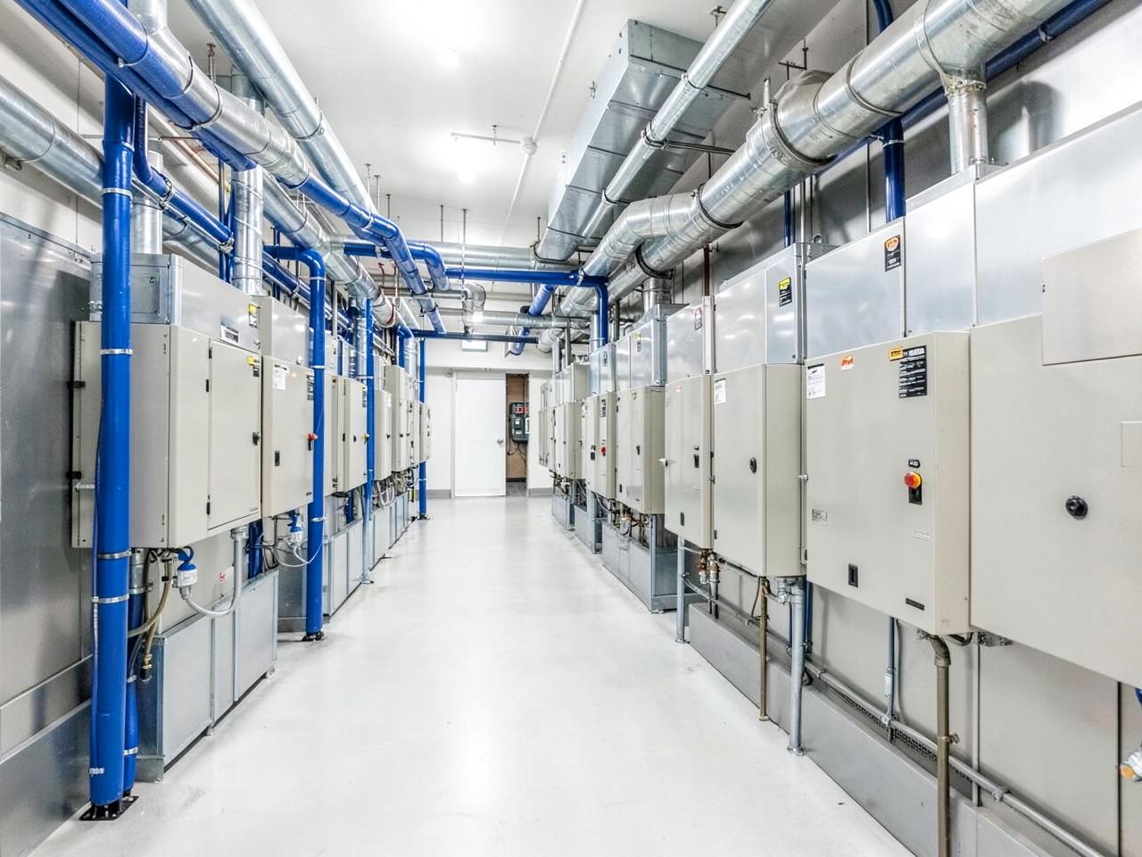 Modern commercial mechanical room with hydronic HVAC units